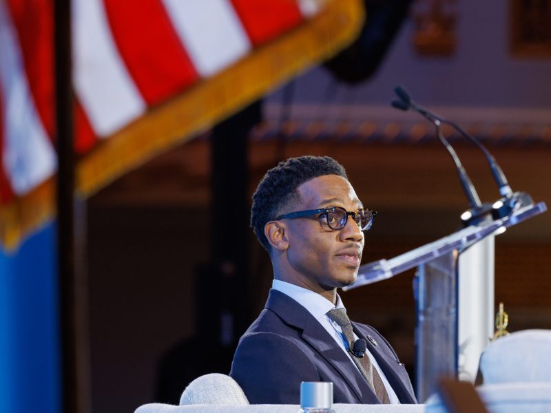Mayor Justin Bibb sits on stage at Cleveland's Public Auditorium