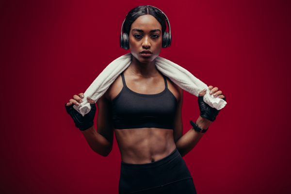 Black woman in workout clothes with headphones