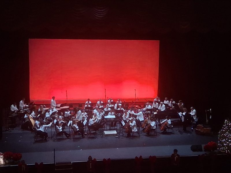 Orchestra on stage, red in the back