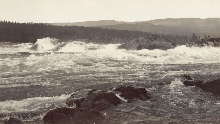 An old photo of a river with rushing rapids