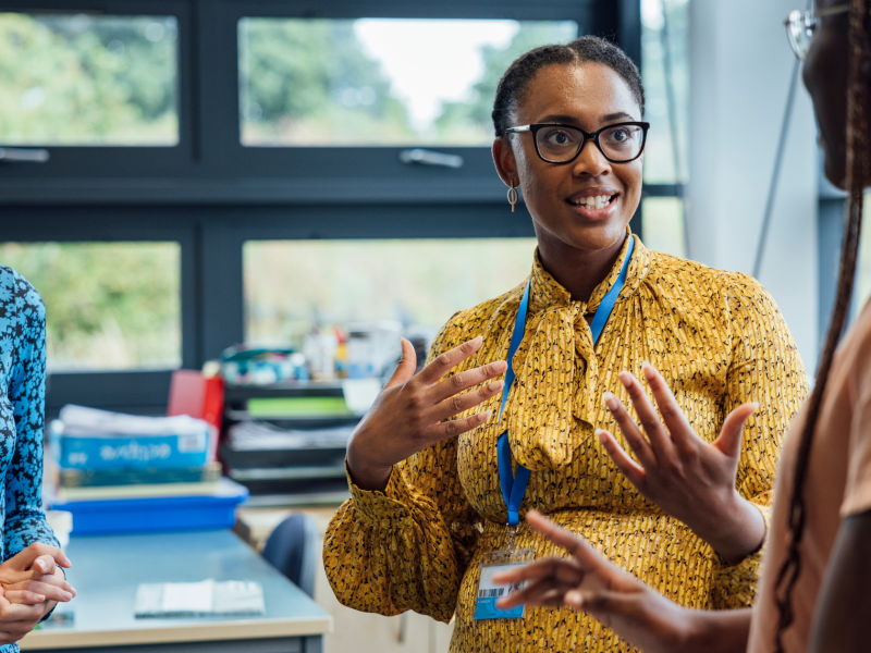 Teachers talking in classroom