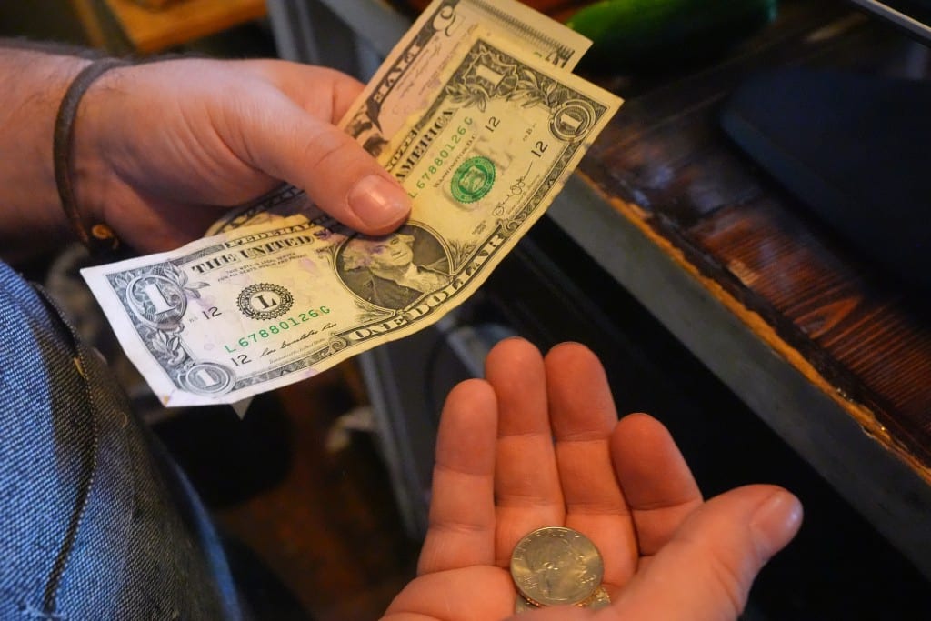 Feature image: hands holding money