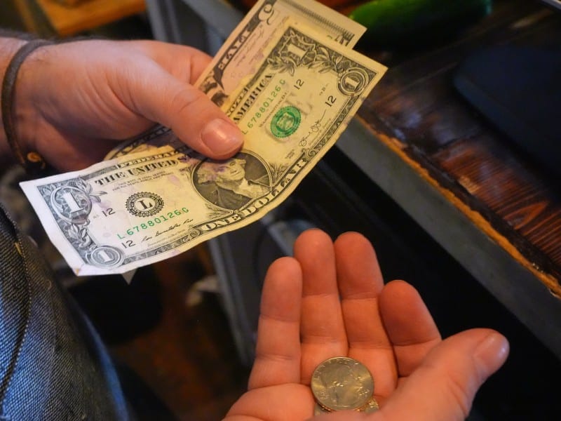 Feature image: hands holding money
