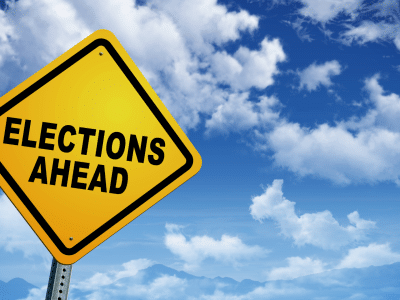 Features and intro image of sign that says Elections Ahead